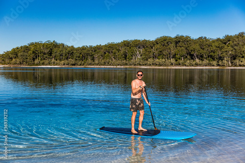 Stand up paddle boarding  on Lake Mckenzie, Fraser Island © Zstock