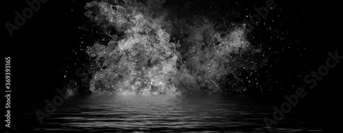Panoramic view black and white fire. Perfect explosion effect for decoration and covering on black background. Concept burn flame and light texture overlays. Reflection on water. © Victor
