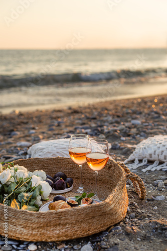 Summertime concept. Outdoor picnic with wine and croissants