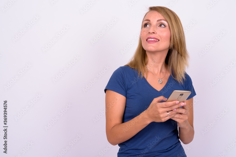 Portrait of happy beautiful woman with blond hair using phone Portrait of happy beautiful woman with blond hair using phone