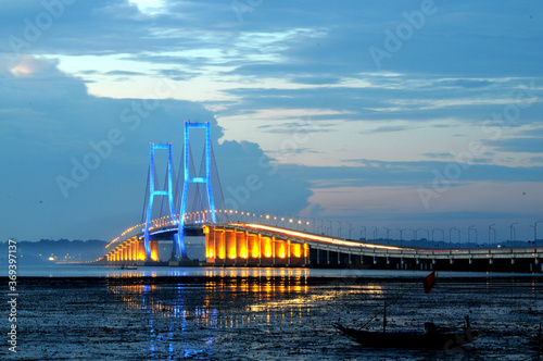 Beautiful scenery before the sun sets on the Suramadu bridge connecting Java Island and Madura Island in Surabaya, East Java, Indonesia
