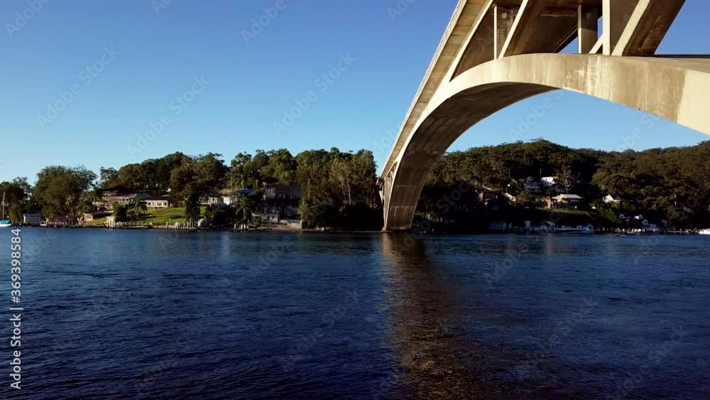 Aerial shot tracking next to bridge over water Australia Aerial shot tracking next to bridge over water Australia