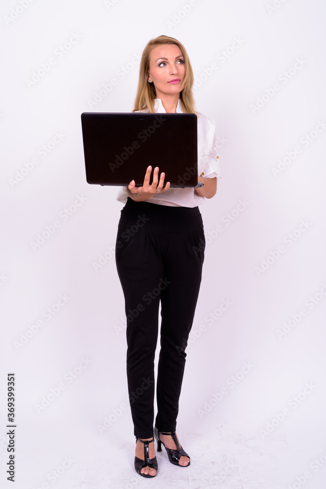 Portrait of beautiful businesswoman with blond hair using laptop Portrait of beautiful businesswoman with blond hair using laptop
