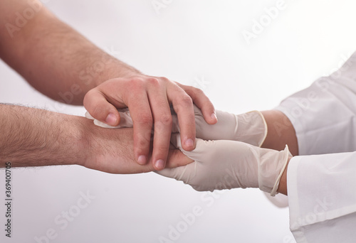 Female doctor holding patients hand. Providing compassion during difficult times
