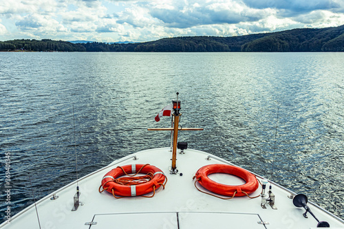 Fototapeta Naklejka Na Ścianę i Meble -  Tourist ship on a lake with lifebuoys. Front of the boat. Solina Bieszczady.
