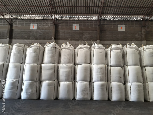Large jumbo hemp sack White, packed with chemical fertilizer, rice, sugar, placed on a wooden pallet waiting to be delivered to the customer
