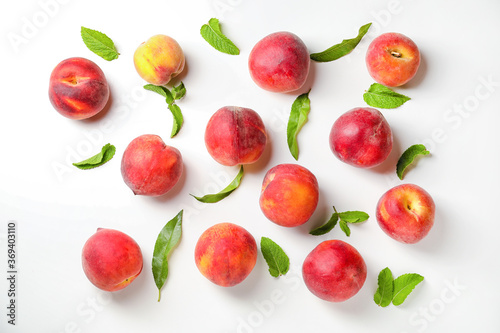 Fototapeta Naklejka Na Ścianę i Meble -  Sweet ripe peaches on white background