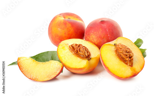 Sweet ripe peaches on white background