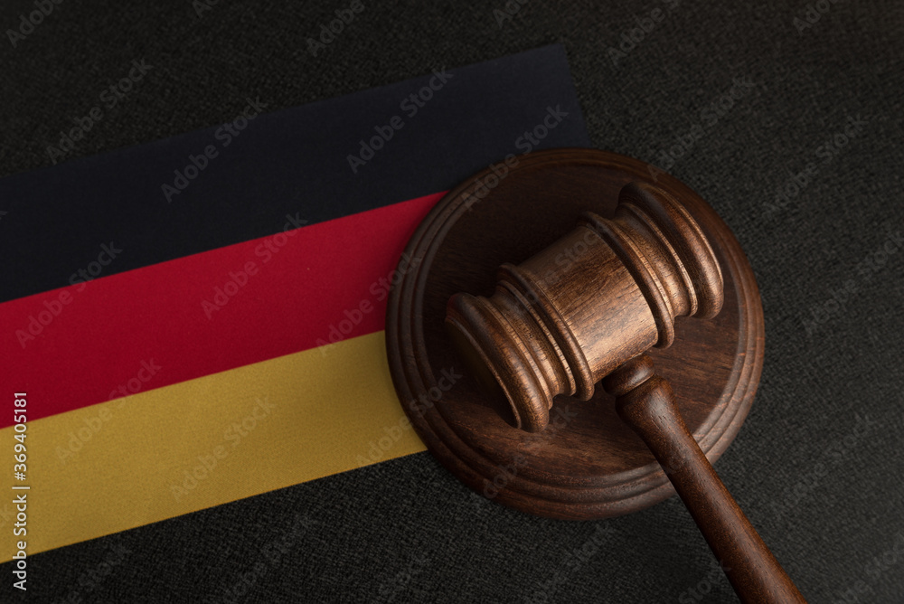 Judge gavel on background of the flag Germany. Law and justice. Constitutional law.
