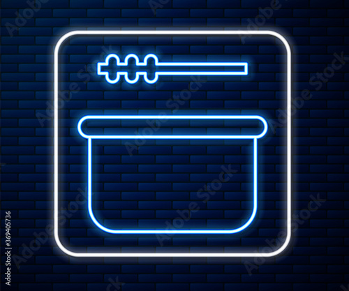 Glowing neon line Sauna bucket and ladle icon isolated on brick wall background. Vector Illustration.