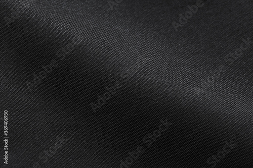 Canvas Polyester texture synthetical for background. Black polyester fabric textile backdrop for interior art design or add text message. photo