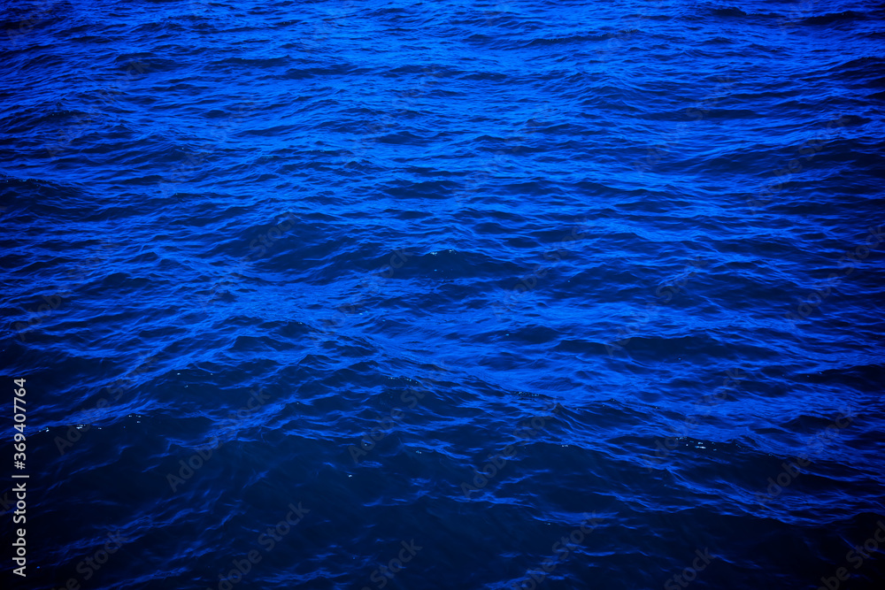 Obraz premium dark deep blue sea water surface background. Backdrop design for art work or add text message.