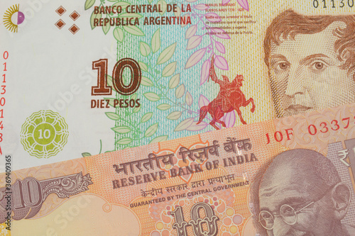 Wallpaper Mural A macro image of a orange ten rupee bill from India paired up with a colorful ten peso note from Argentina.  Shot close up in macro. Torontodigital.ca