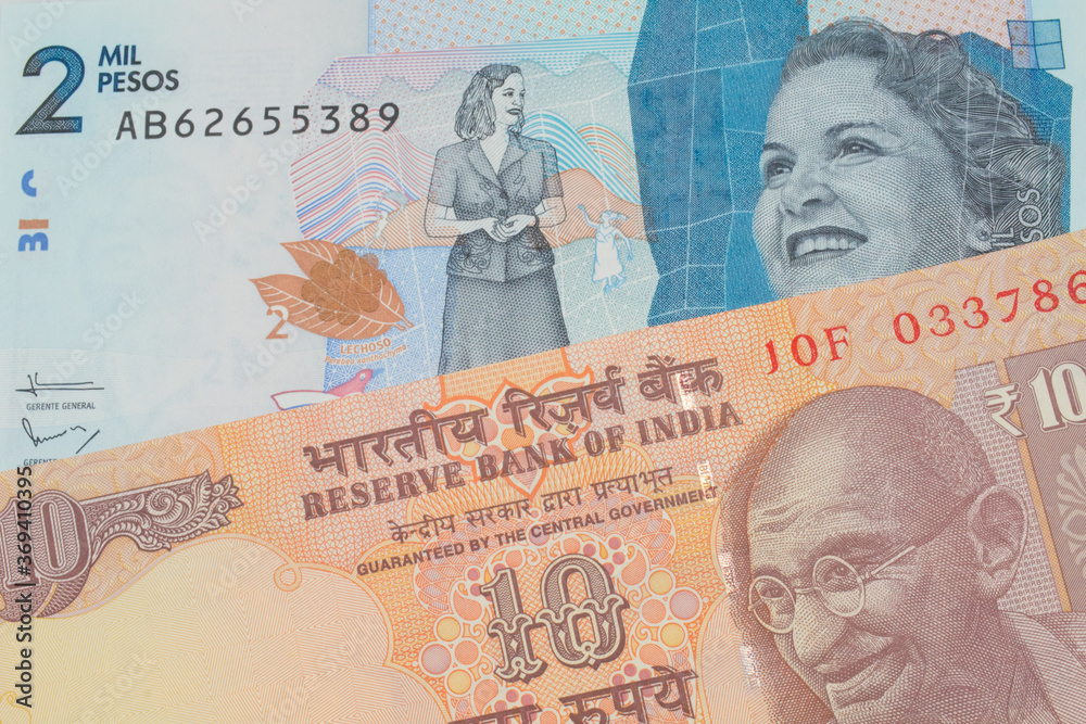 custom made wallpaper toronto digitalA macro image of a orange ten rupee bill from India paired up with a blue two thousand bank note from Colombia.  Shot close up in macro.