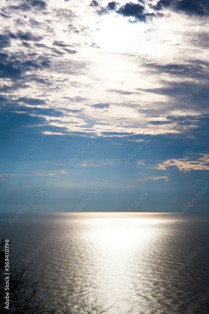 Obraz premium Beautiful beach in Thailand. View of sunlight tropical sea beach. Tropical sand beach holiday for background and vacation travel concept.