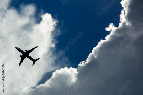 The plane takes off against the background of clouds