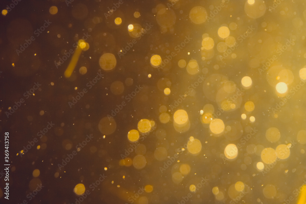Dark Abstract Gold bokeh sparkle on black Dark Abstract Gold bokeh sparkle on black