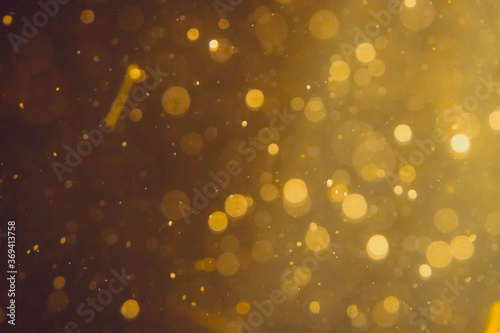 Dark Abstract Gold bokeh sparkle on black