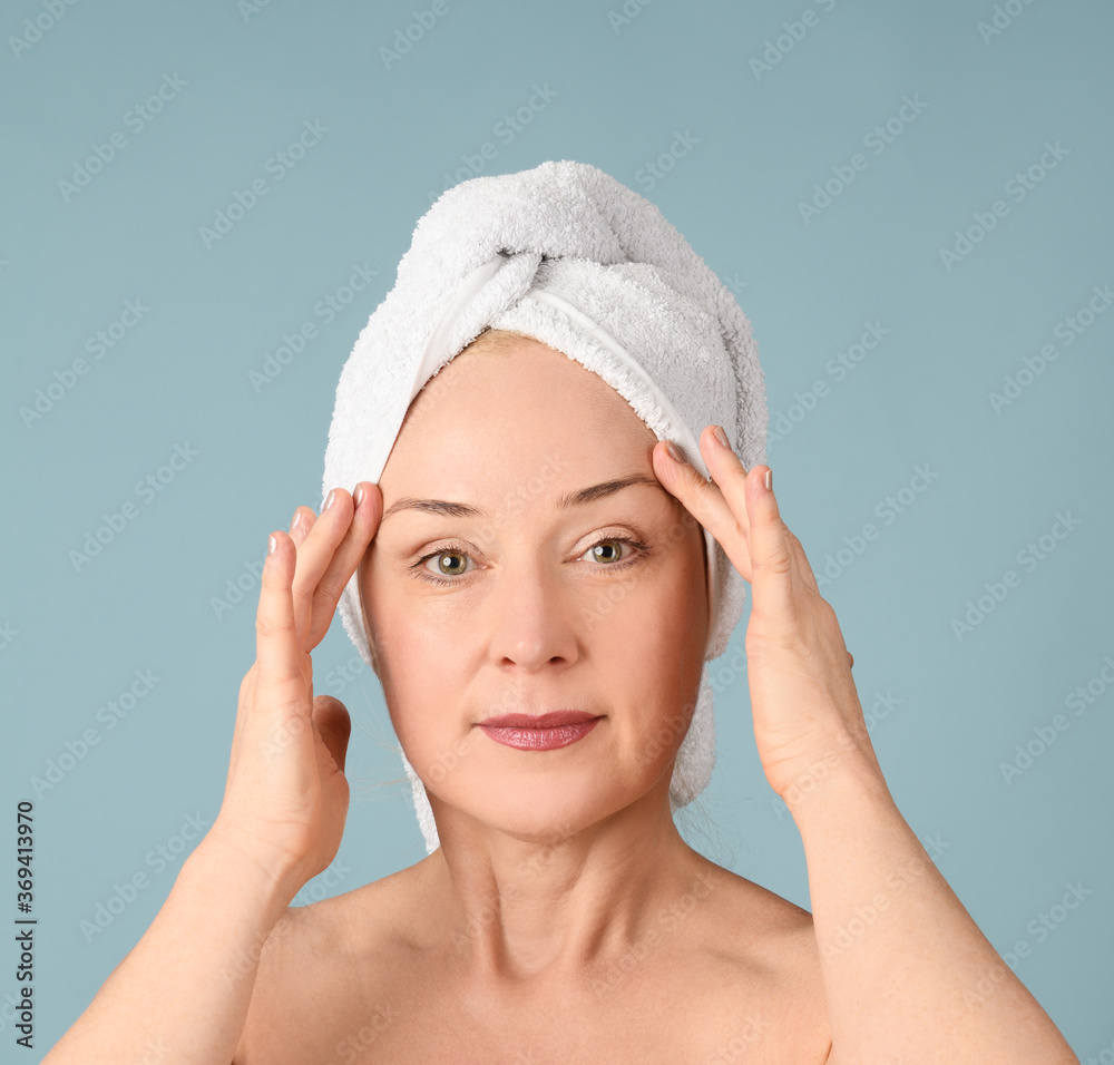 Portrait of cheerful woman with towel on head Portrait of cheerful woman with towel on head