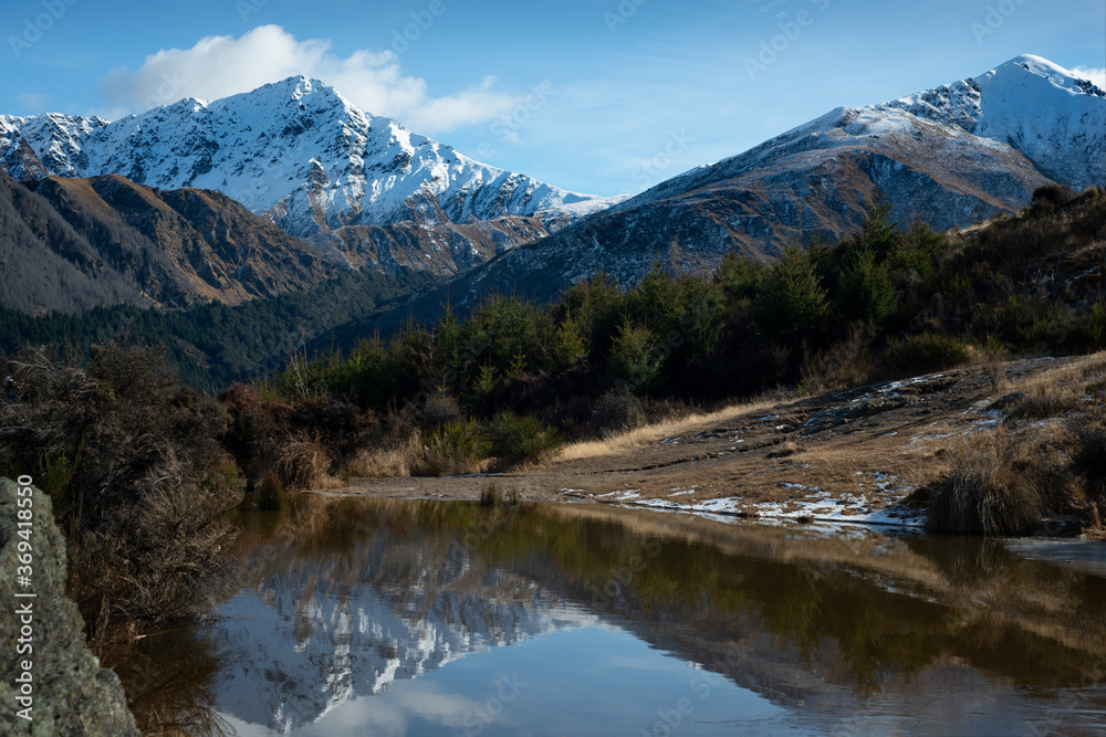 View of the mountain and reflections in winter from the Queenstown Hill Walkway track