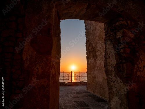 Ruins of Castello della Valle overlooking the Tyrrhenian Sea at sunset, an old castle in Fiumefreddo Bruzio, Calabria, south Italy