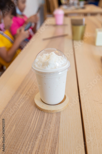 Glass of fresh milk, smoothies, popular drinks Place on the coasters and white background