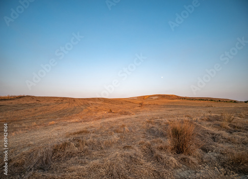 dry fields clay hills called Sciolle at sunset in the province of Crotone  Calabria  Italy.