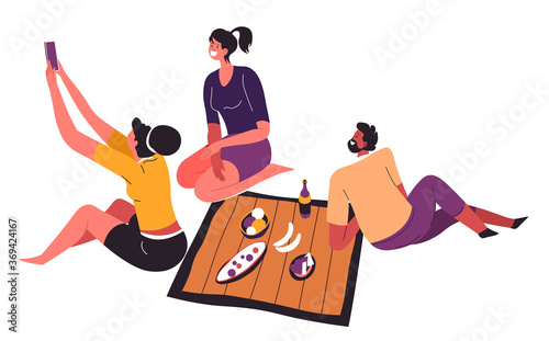 People taking selfie while having picnic outdoors vector