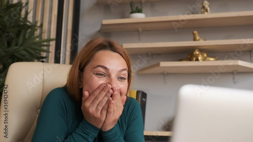 Surprised woman face looking at laptop screen. Close up of bussineswoman watch online news at computer. Portrait of happy girl shopping website at laptop