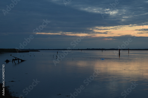 Long exposure golden sunset over Breydon Water  a stretch of the River Yare at Great Yarmouth  Norfolk  UK