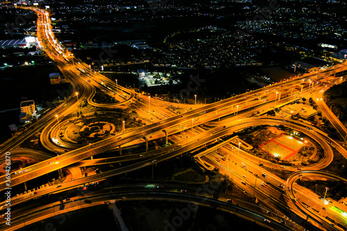 Cross motorway traffic junction road into the city at night