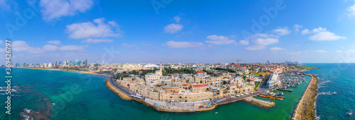 Fototapeta Naklejka Na Ścianę i Meble -  Aerial view of Jaffa old city port with marina coastline and general view of both Jaffa and Tel Aviv.
