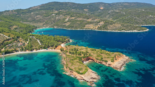 Aerial photo taken by drone of Caribbean tropical exotic island lagoon with turquoise clear sea sandy beaches and rare pine trees