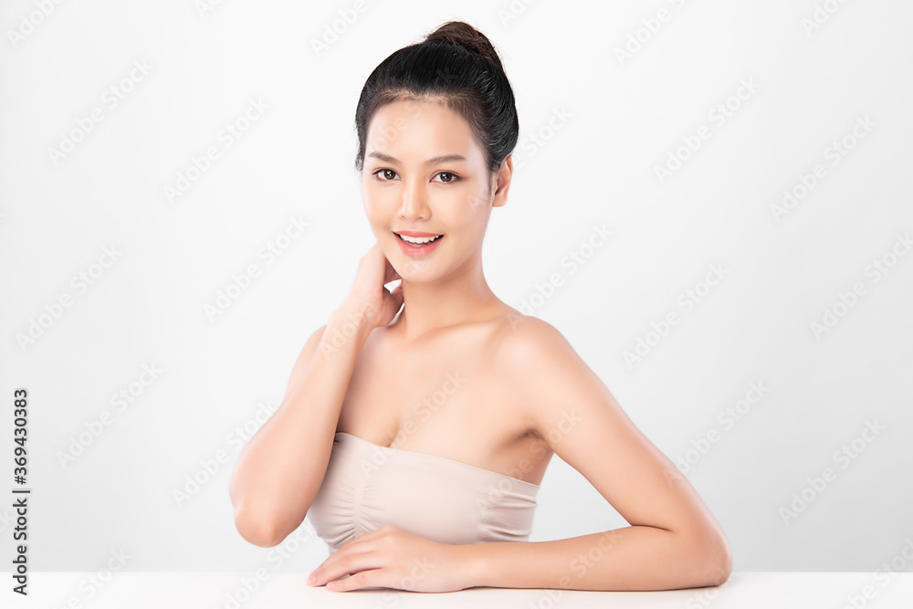 Beautiful Young asian Woman with Clean Fresh Skin, on white background, Face care, Facial treatment, Cosmetology, beauty and spa, Asian women portrait Beautiful Young asian Woman with Clean Fresh Skin, on white background, Face care, Facial treatment, Cosmetology, beauty and spa, Asian women portrait