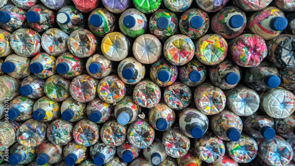 Used bottles filled with plastic twelve which are cut into small pieces to make beautiful colors Used bottles filled with plastic twelve which are cut into small pieces to make beautiful colors