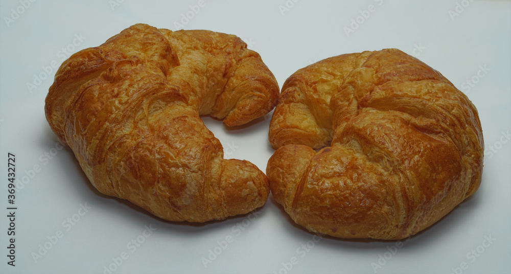 Two plain croissants on the white background copy space.
