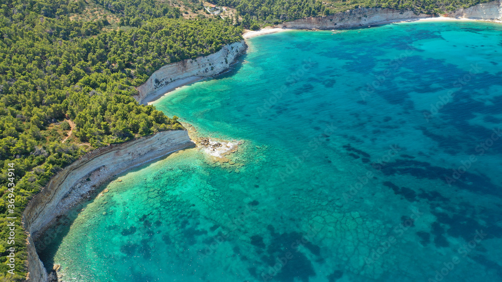 Aerial drone panoramic photo of secluded paradise beach and bay of Spartines with crystal clear turquoise sea, Alonissos island, Sporades, Greece 