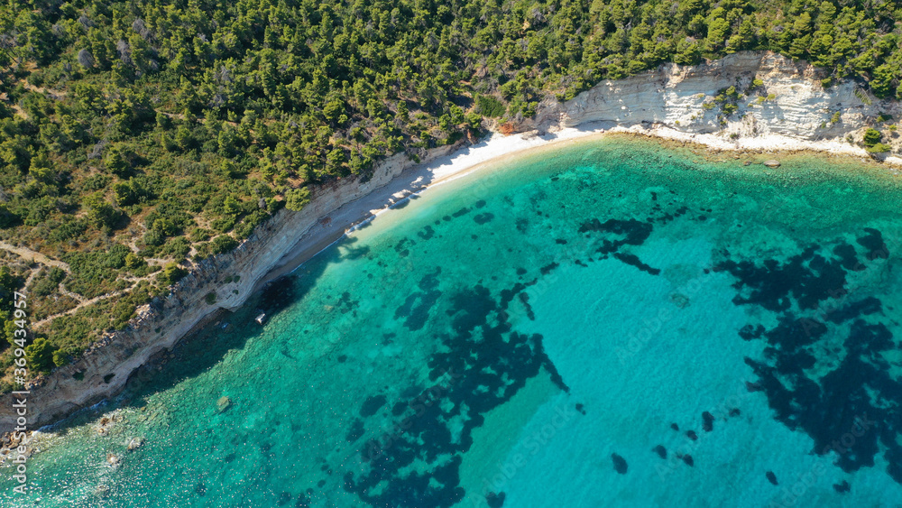 Fototapeta premium Aerial photo taken by drone of Caribbean tropical exotic island lagoon with turquoise clear sea sandy beaches and rare pine trees