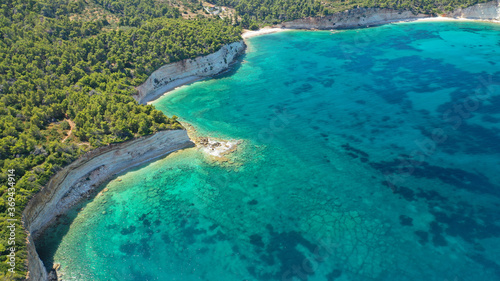 Aerial drone panoramic photo of secluded paradise beach and bay of Spartines with crystal clear turquoise sea, Alonissos island, Sporades, Greece  © aerial-drone