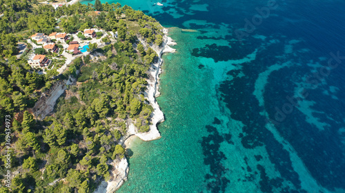 Aerial drone panoramic photo of secluded paradise beach and bay of Spartines with crystal clear turquoise sea, Alonissos island, Sporades, Greece 