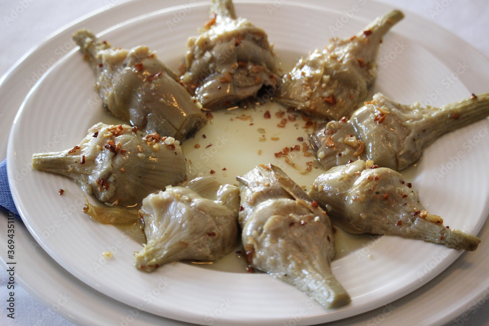 Artichoke dish. Cooked with sauce and garlic