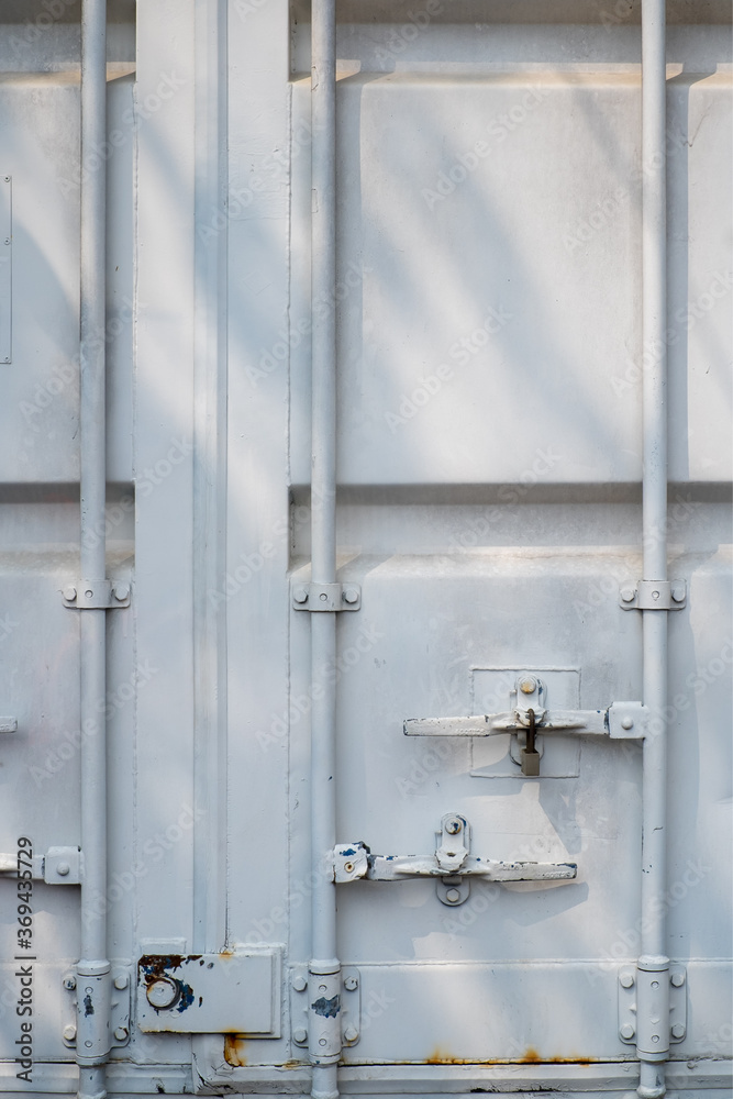 Closed white logistic container cargo door. Closed white logistic container cargo door.