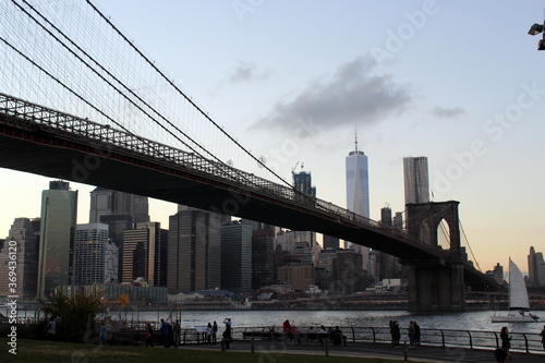 Panorama view of the Manhattan skyline and the Brooklyn Bridge at dusk, evening - Hudson River - New York  © Augusto