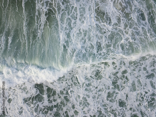 Aerial photo of a small surf break off the coast of New Zealand. 