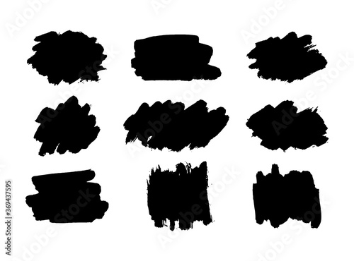 Hand drawn vector ink brush strokes, black paint spot set. Dirty paint smears artistic backgrounds. Grunge texture scribbles design element isolated on white. Stains shapes and silhouettes photo
