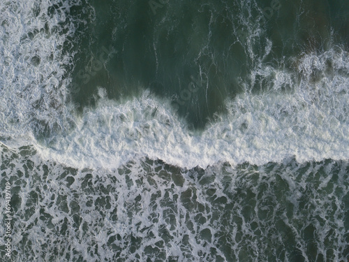 Aerial photo of a small surf break off the coast of New Zealand. 