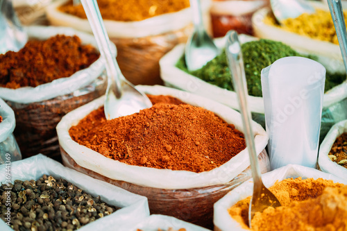 Fototapeta Naklejka Na Ścianę i Meble -  Close View Of Masala Curry, Bright Colors Fragrant Seasoning, Condiment In Bags On Local Food Market, Bazaar