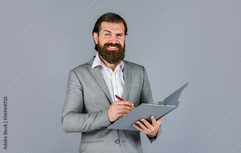 serious boss with document. Ready for sale. Pleasant cheerful handsome realtor holding folder. bearded man working in office. Portrait of successful businessman dressed in formal clothes. happy day serious boss with document. Ready for sale. Pleasant cheerful handsome realtor holding folder. bearded man working in office. Portrait of successful businessman dressed in formal clothes. happy day