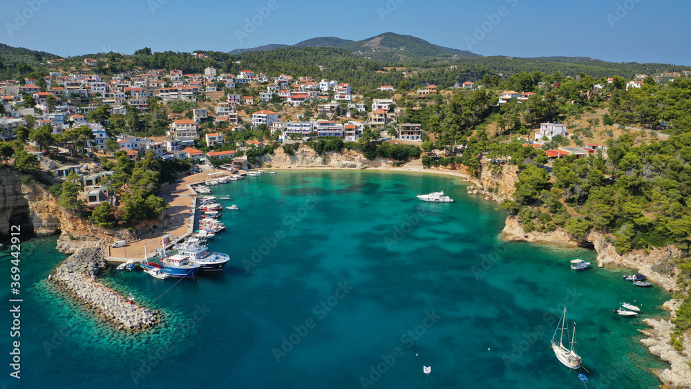Aerial drone photo of famous small fishing port and village of Votsi in island of Alonissos, Sporades, Greece Aerial drone photo of famous small fishing port and village of Votsi in island of Alonissos, Sporades, Greece
