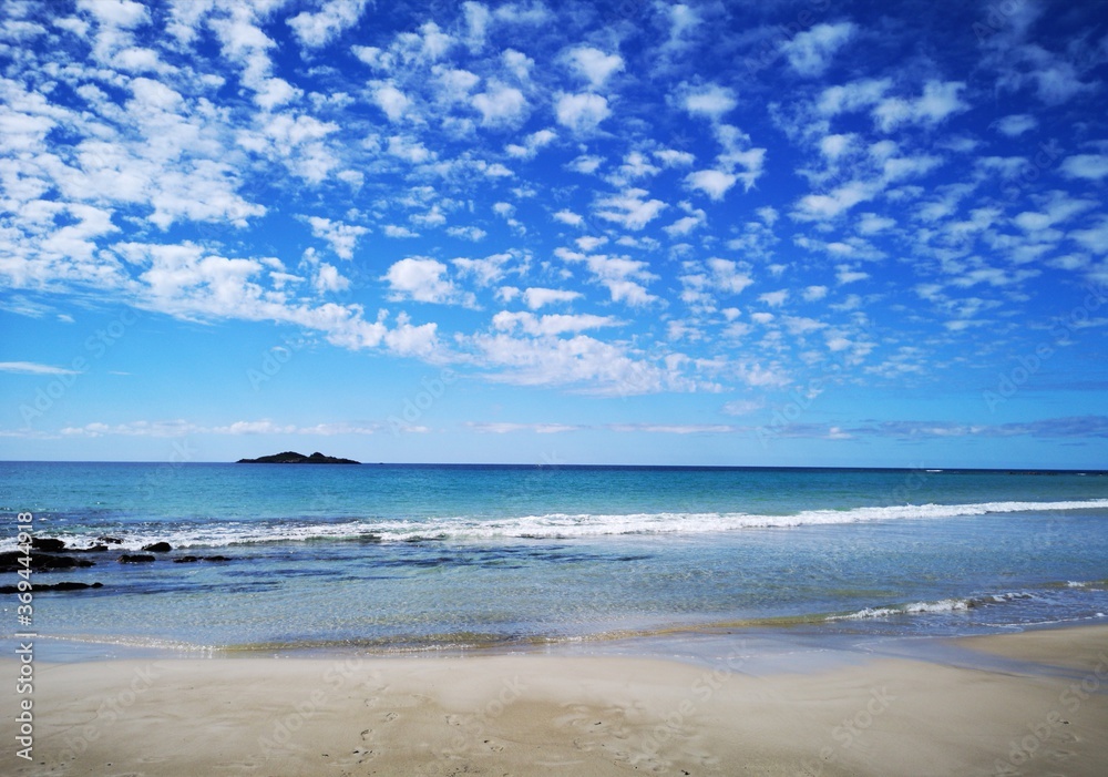 Sisters Beach - beautiful blue sky day on the north west Tasmanian coast with white sands and aqua blue seas - Australia